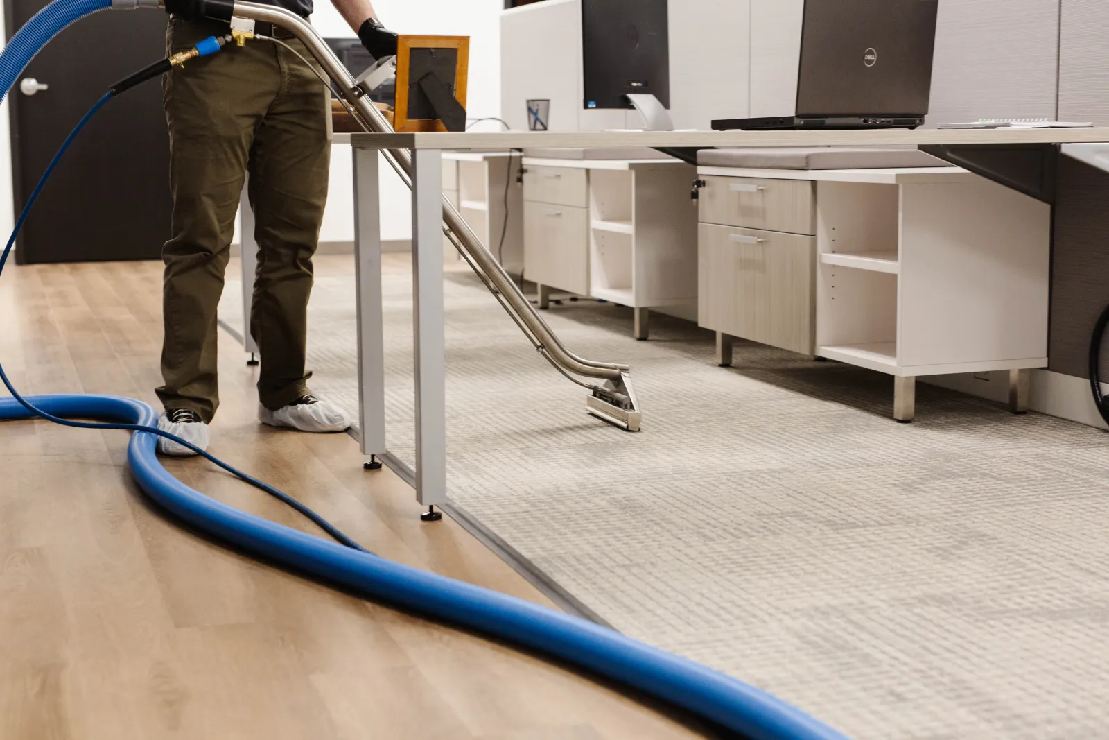 carpet cleaning technician cleaning office